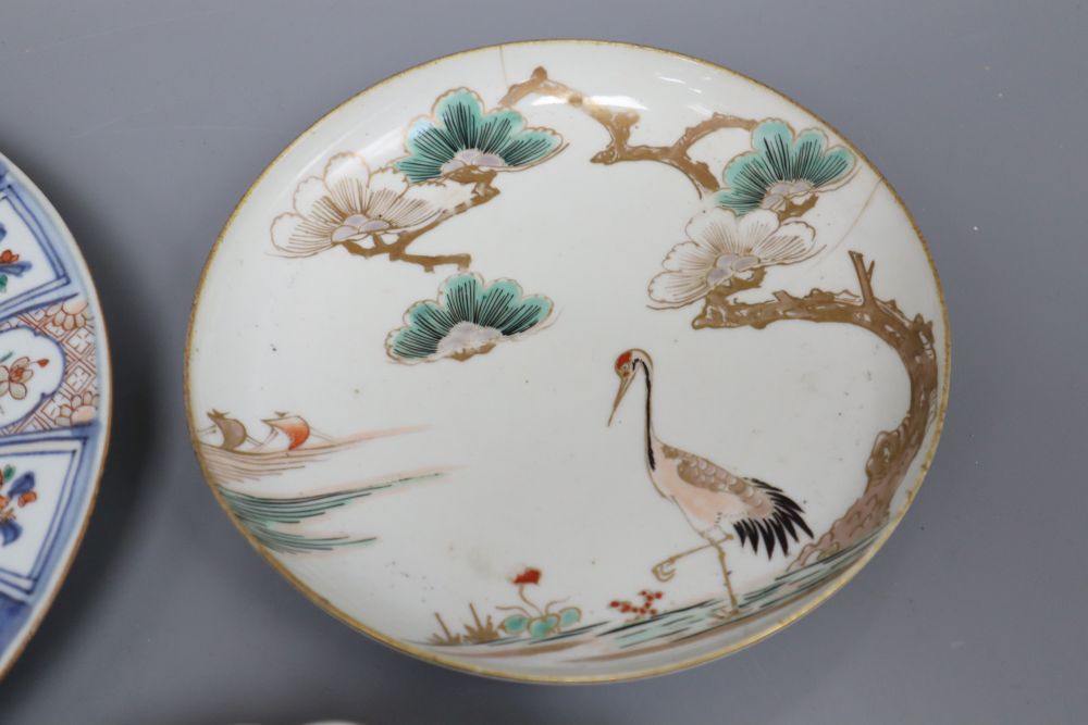 A 17th century Arita crane dish and an 18th century Chinese Imari fluted dish and similar soup plate, largest diameter 26cm